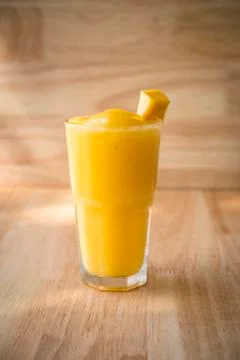 Mango Fruit shake with piece of mango for decor Stock Photos