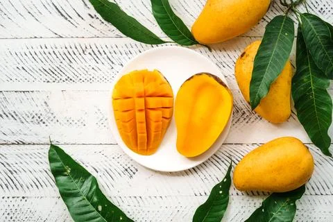 Mango fruit,fresh yellow mango on white wood Stock Photos