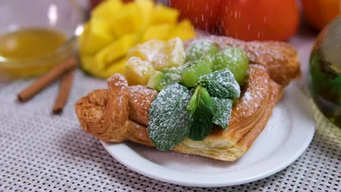 Mango grapes mint sprinkle with powdered sugar cake Stock Footage 295953922