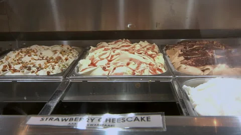 Mango Ice Cream Added To Ice Cream Display Stock Footage 136342933