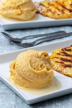 Mango ice cream with pineapple Stock Photos