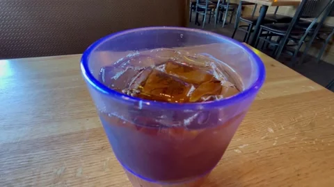 A Mango Ice Tea on a Restaurant Table Stock Footage 319540248