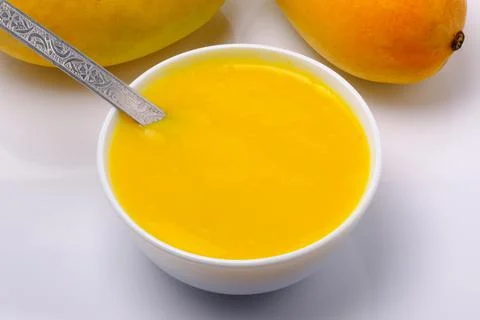 Mango juice or shake in bowl Stock Photos