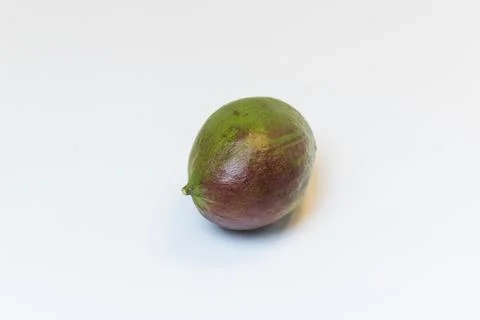 Mango laid on its side on a white background Foto stock