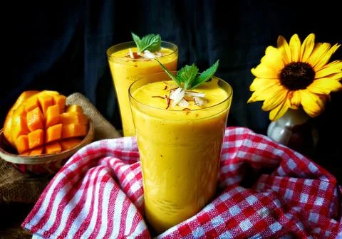 Mango lassi is a refreshing yogurt drink perfect for hot summers Stock Photos