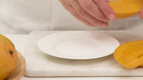 Mango. Mango, peach fruit salad. Fresh ripe organic yellow mangoes close up Stock Footage 132561355