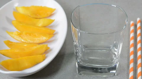 Mango milkshake in a glass cup Stockbeeldmateriaal 132867674