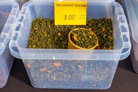 Mango Oolong Tea In Plastic Bin With Price Tag Stock Photos