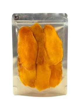 Mango in the package isolate. Pieces of dried mango on a white background Stock Photos