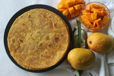 Mango Paratha. Indian flatbread made of wheat flour and mango pulp. A sweet v Stock Photos