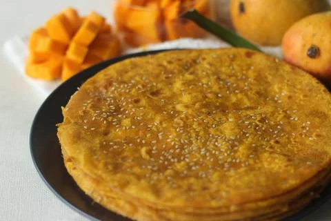 Mango Paratha. Indian flatbread made of wheat flour and mango pulp. A sweet v Fotos Stock