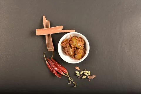 Mango pickle garnish with spices.A mango pickle is a variety of pickle prepar Stock Photos