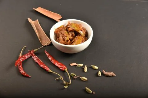 Mango pickle garnish with spices.A mango pickle is a variety of pickle prepar Stock Photos