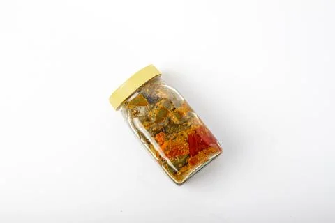 Mango Pickle jar with yellow cap on white background Stock Photos