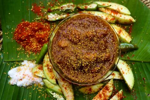 Mango pickle raw mango sliced with chilly salt Stock Photos