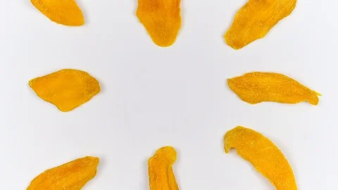 Mango pieces on kitchen Board on white background stop motion Stock Footage 108804563