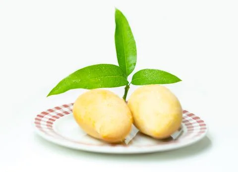 Mango on plate laying on isolate white background. Stock Photos