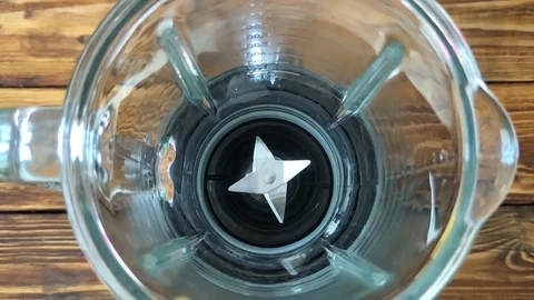 Mango is pouring to blender, super slow motion video Stock Footage 89488057