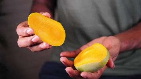 Mango preparation in a kitchen during the afternoon Stock Footage 345189126