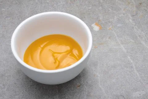 Mango puree in dish Stock Photos