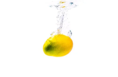 Mango sinking in water isolated on white Stock Photos