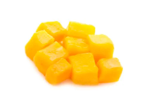 Mango slice cut to cubes close-up isolated on white background Stock Photos