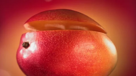 Mango Slice falling and splashing on yellow pink background. Food levitation Video stock 193081621