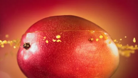Mango Slice falling and splashing on yellow pink background. Food levitation Video stock 193083652