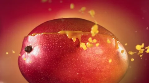 Mango Slice falling and splashing on yellow pink background. Food levitation Video stock 193087390