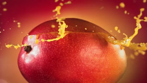 Mango Slice falling and splashing on yellow pink background. Food levitation Video stock 193088258