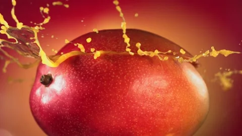 Mango Slice falling and splashing on yellow pink background. Food levitation Video stock 193088387
