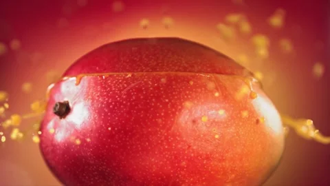 Mango Slice falling and splashing on yellow pink background. Food levitation Video stock 193094083