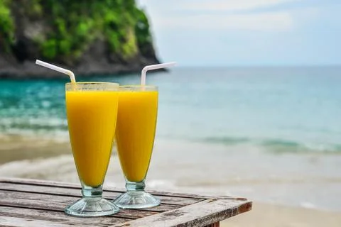 Mango smoothies at beach Stock Photos
