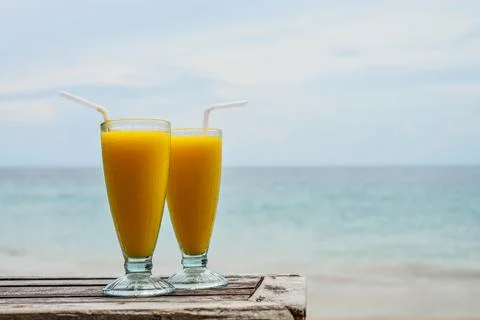 Mango smoothies at beach Stock Photos