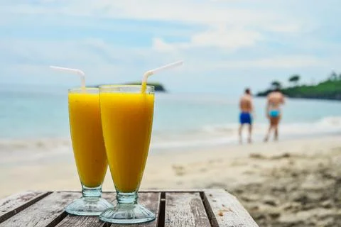 Mango smoothies at beach Stock Photos