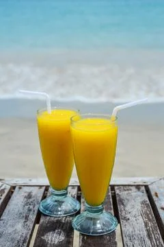 Mango smoothies at beach Stock Photos