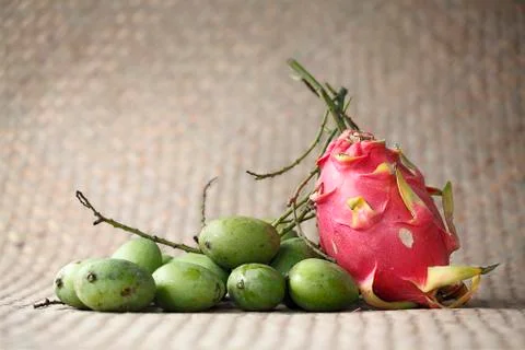 Mango stack with dragon fruit on mat background (still life) Stock Photos
