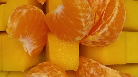 Mango with tangerines macro photography Stock Footage 329666087