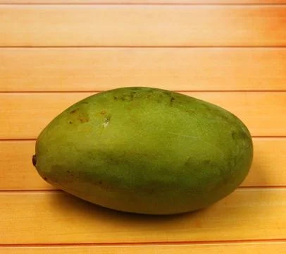 Mango on a wood table top Stock Photos