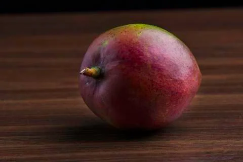 Mango on the wooden table Stock Photos