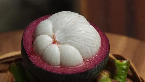 Mangosteen with cut in half. Close up. Stock Footage 310035719