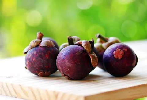 Mangosteen fruit on table Stock Photos