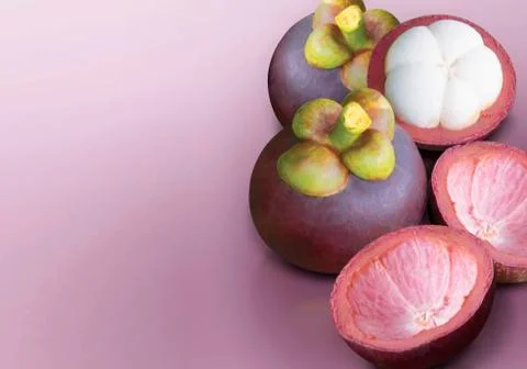 Mangosteen on purple solid background Stock Photos