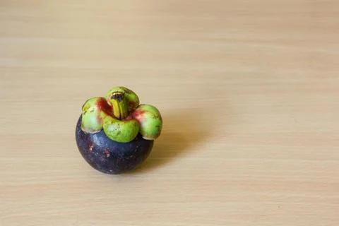 Mangosteen on table Stock Photos