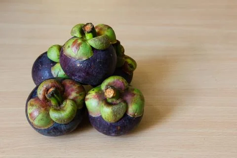 Mangosteen on table Stock Photos