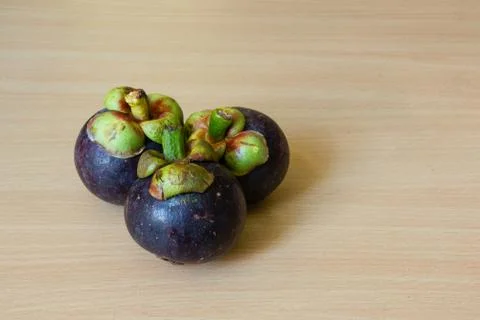 Mangosteens on table Stock Photos