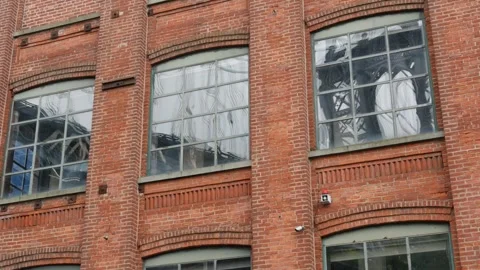 Manhattan bridge in Brooklyn Dumbo. Red brick building on Washington street. New Stock Footage 320857487
