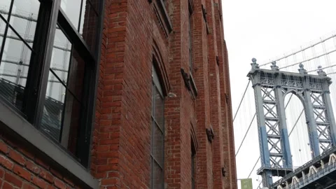 Manhattan bridge in Brooklyn Dumbo. Red brick building on Washington street. New Stock Footage 327143764