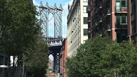 Manhattan bridge, view between the buildings - New York, Brooklyn Stock Footage 71073032