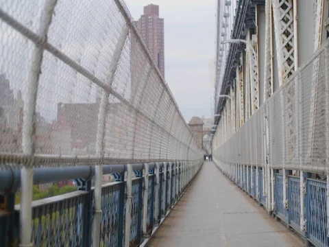 On the Manhattan Bridge while a train passes by Stock Footage 81690151